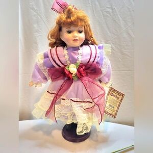 Porcelain Doll with stand and certificate of authentication